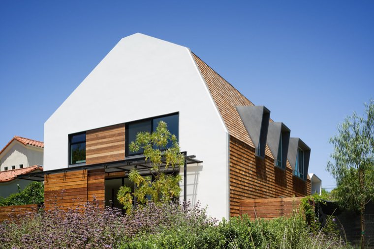 Exterior listing photograph showing the home and its surroundings